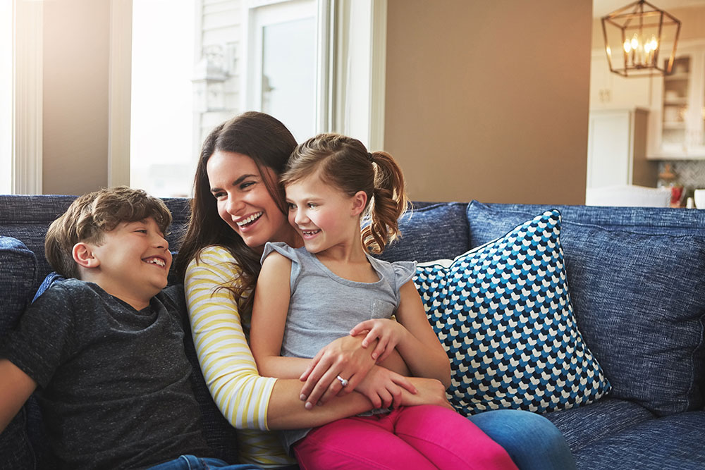 A young woman spending time with her children